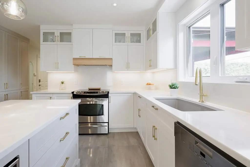 Contemporary kitchen blending functionality and aesthetics. The central island, white cabinets, and quartz countertop make for a chic yet inviting setting