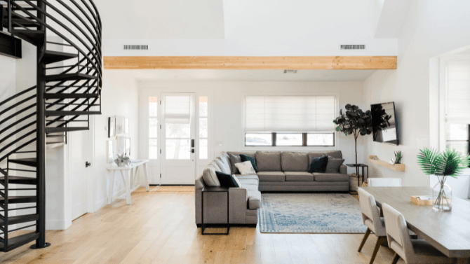 simple living space with few furniture pieces and neutral colours 